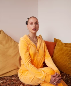 JUICY COUTURE BLAZING ORANGE CLASSIC VELOUR DEL RAY POCKETED BOTTOMS